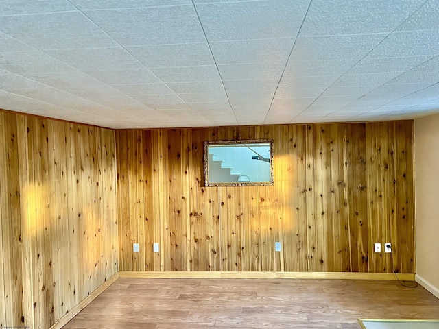 unfurnished room featuring hardwood / wood-style flooring