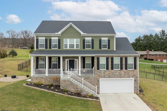 colonial inspired home featuring a garage, covered porch, and a front lawn