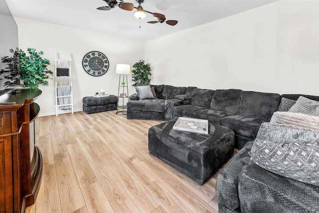 living room with ceiling fan and wood-type flooring