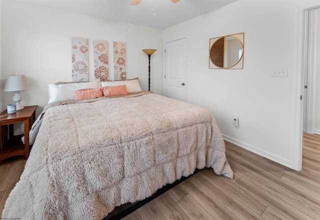 bedroom featuring hardwood / wood-style flooring and ceiling fan