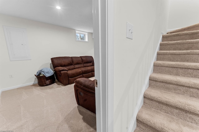 stairway featuring carpet and electric panel