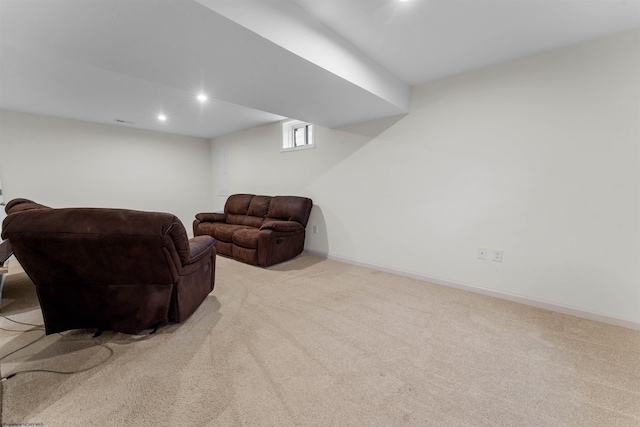 living area featuring light carpet