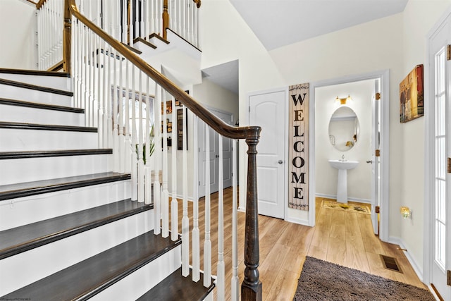 stairs with hardwood / wood-style flooring