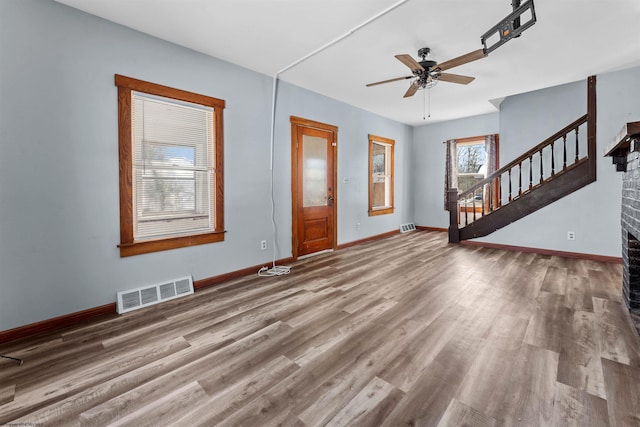 interior space featuring ceiling fan and wood-type flooring