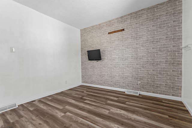 unfurnished room with dark hardwood / wood-style flooring