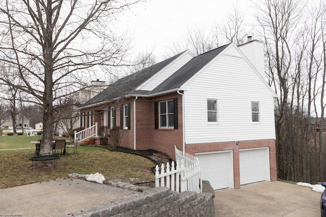 view of property exterior featuring a garage and a lawn