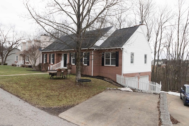 view of front of home with a garage and a front yard