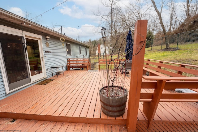 wooden terrace with a yard