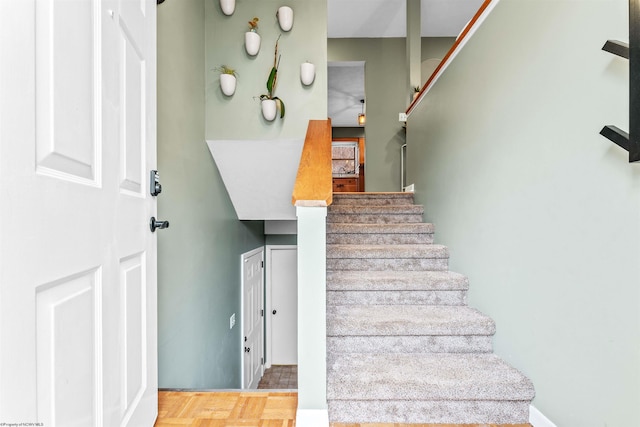 staircase with parquet flooring