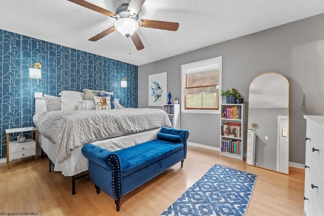 bedroom with hardwood / wood-style floors and ceiling fan