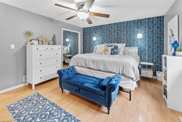 bedroom with ceiling fan and light wood-type flooring