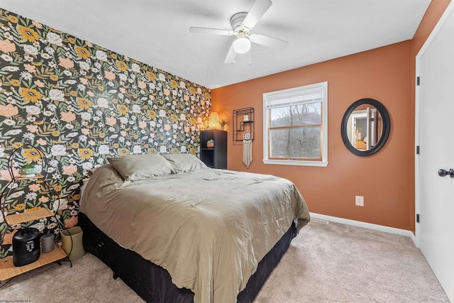 bedroom featuring ceiling fan and light carpet