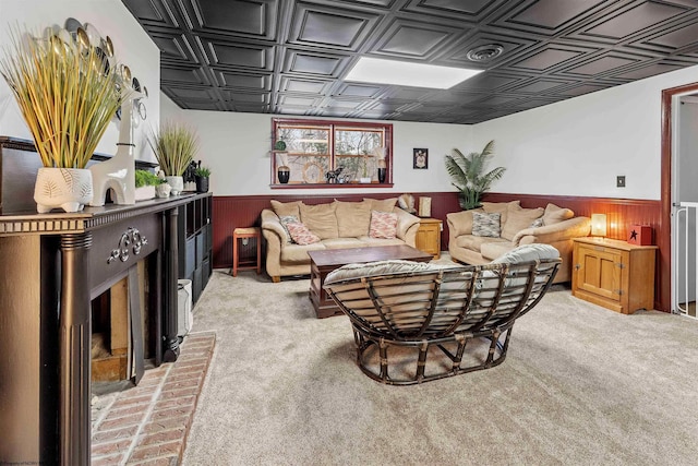 living room with light carpet and wooden walls