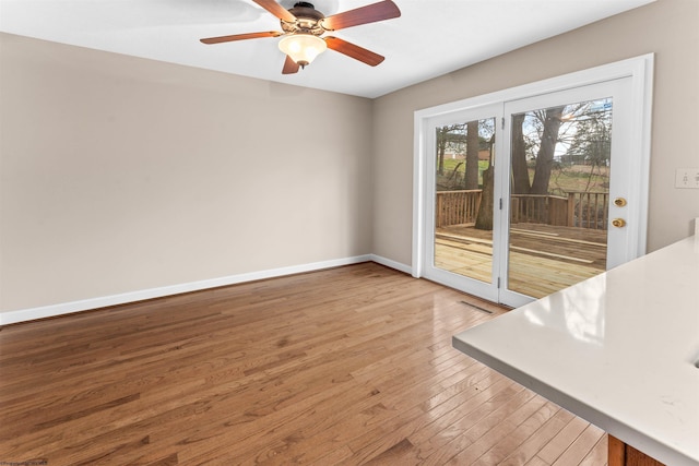 interior space with hardwood / wood-style flooring and ceiling fan