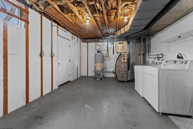 basement with washer and clothes dryer and gas water heater