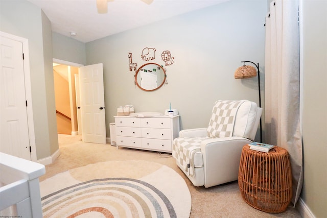 living area featuring light carpet