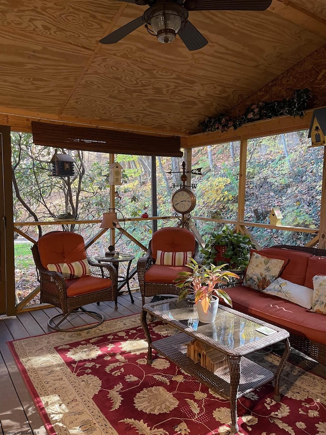 sunroom with wood ceiling and ceiling fan