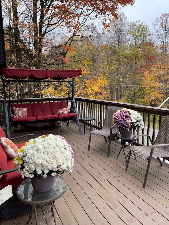 wooden deck featuring an outdoor living space