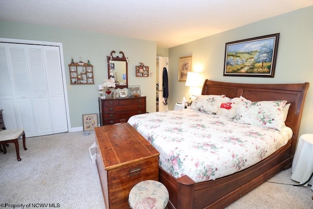 carpeted bedroom featuring a closet