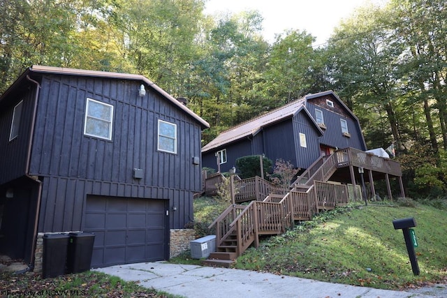 view of front of property with a garage and a deck