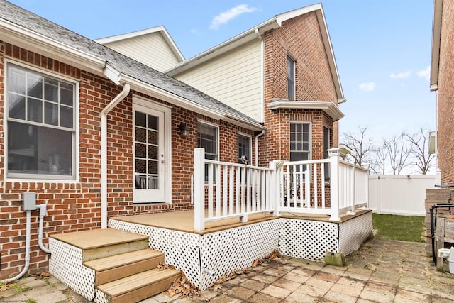 rear view of house with a patio and a deck