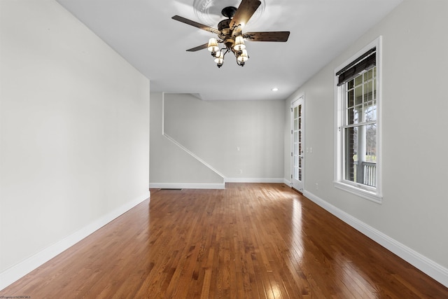 spare room featuring ceiling fan and hardwood / wood-style floors