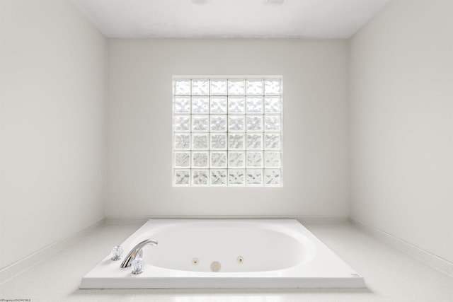 bathroom featuring tiled bath