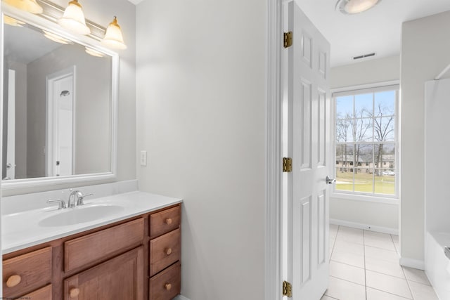 bathroom with vanity and tile patterned flooring