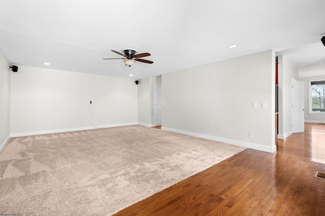 spare room featuring ceiling fan and light hardwood / wood-style flooring