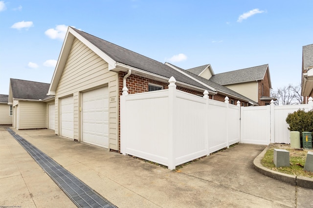 view of side of property featuring a garage