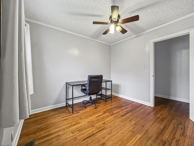 office featuring ornamental molding, wood-type flooring, and a textured ceiling