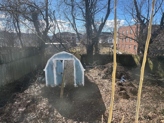 view of storm shelter featuring a storage unit