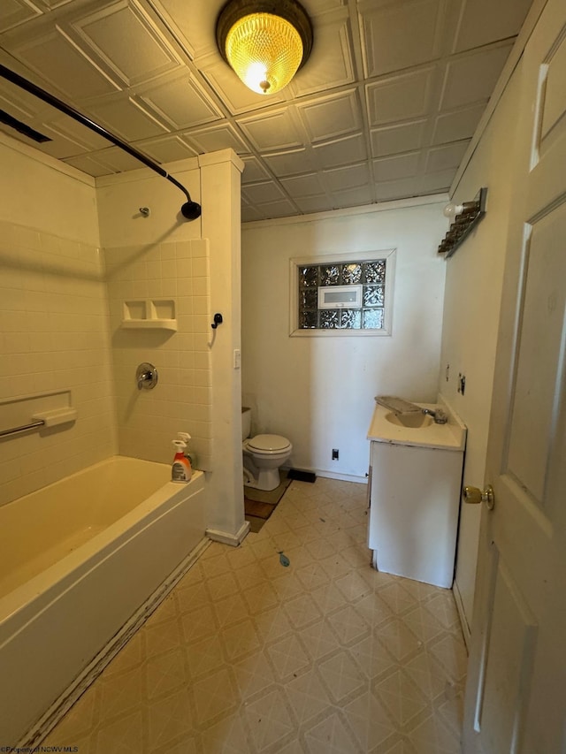 full bathroom with vanity, toilet, and tiled shower / bath combo