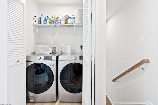 laundry area with separate washer and dryer