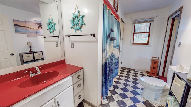 bathroom with vanity, toilet, and a shower with shower curtain