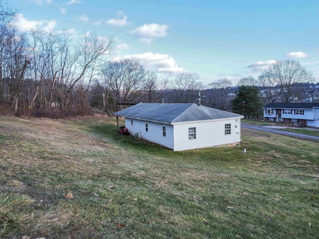 view of property exterior featuring a yard