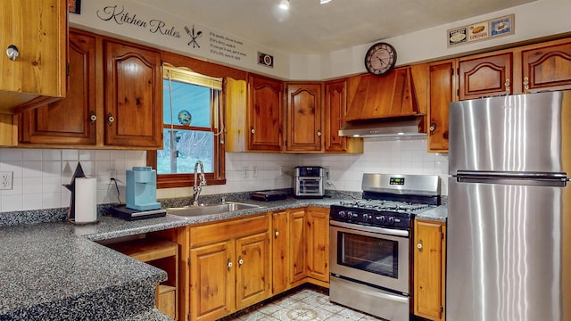 kitchen with sink, decorative backsplash, custom exhaust hood, and stainless steel appliances