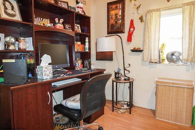 office with light hardwood / wood-style flooring