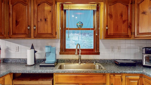 kitchen featuring sink and backsplash