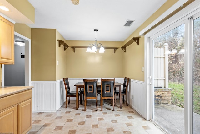 dining room featuring a notable chandelier