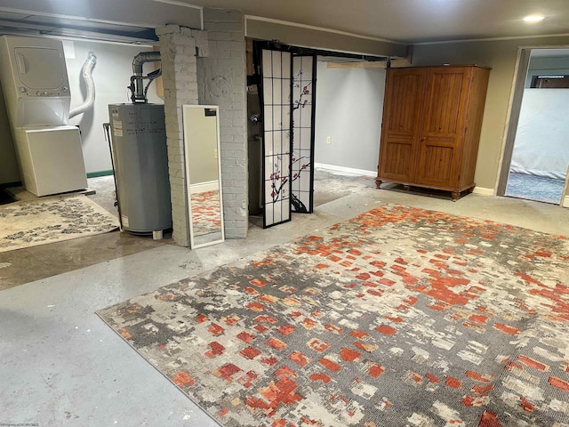 basement with stacked washer and dryer and gas water heater