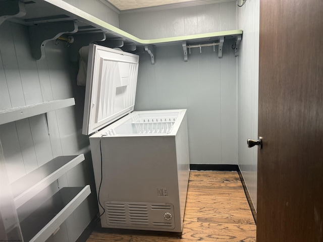 walk in closet with dark wood-type flooring