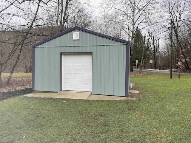 garage featuring a lawn