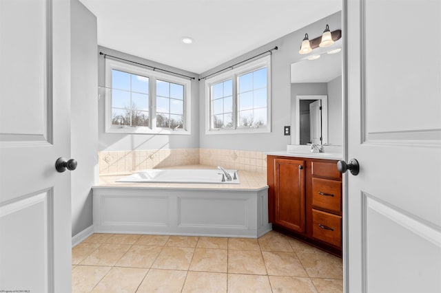 bathroom featuring vanity, a bathtub, and tile patterned flooring