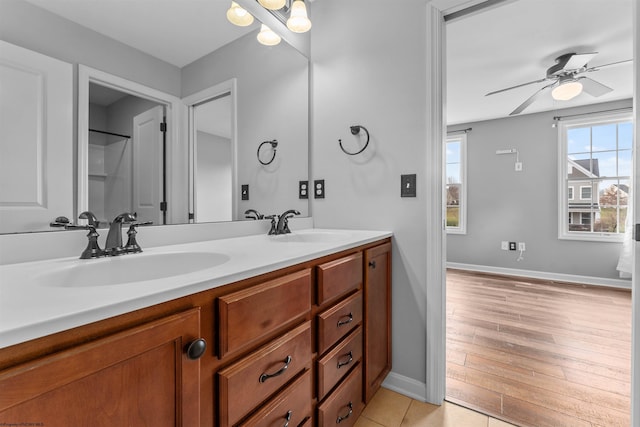 bathroom with vanity, hardwood / wood-style floors, and ceiling fan