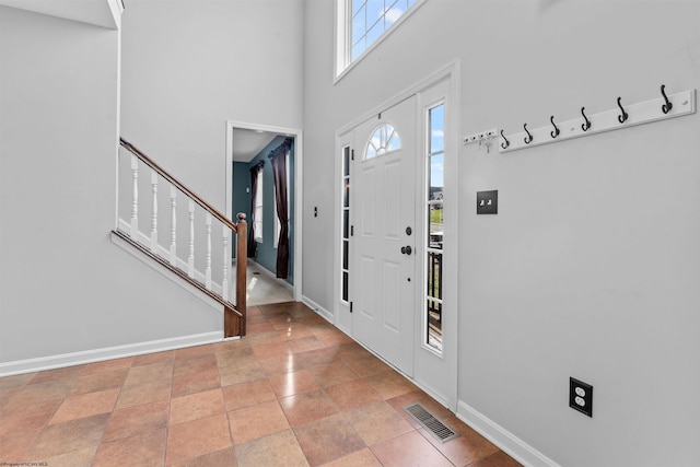 entryway with a towering ceiling