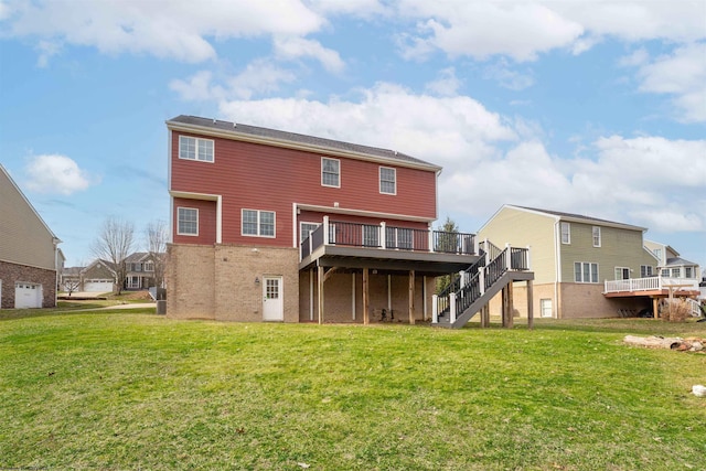 back of property with a deck and a lawn