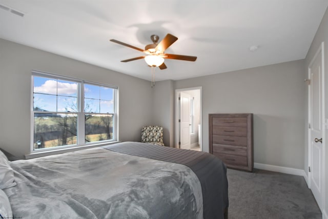 carpeted bedroom featuring connected bathroom and ceiling fan