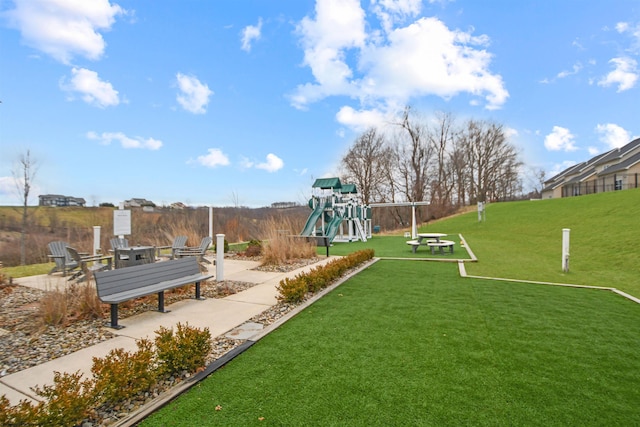 exterior space featuring a playground and a yard