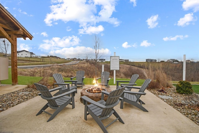 view of patio / terrace featuring an outdoor fire pit